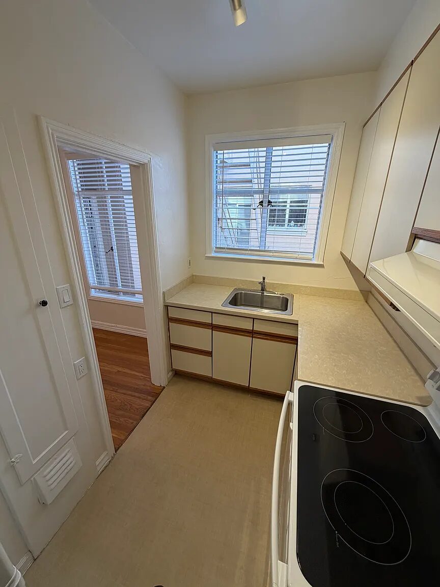 Galley kitchen looking through the doorway to the living room